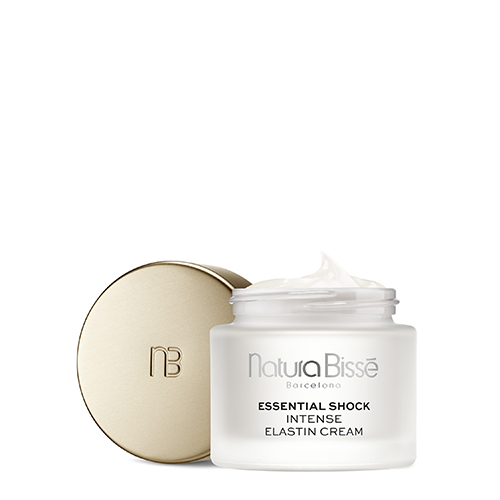 Een geopende pot Natura Bissé Essential Shock Intense Elastin Cream met de gouden dop ernaast geplaatst.