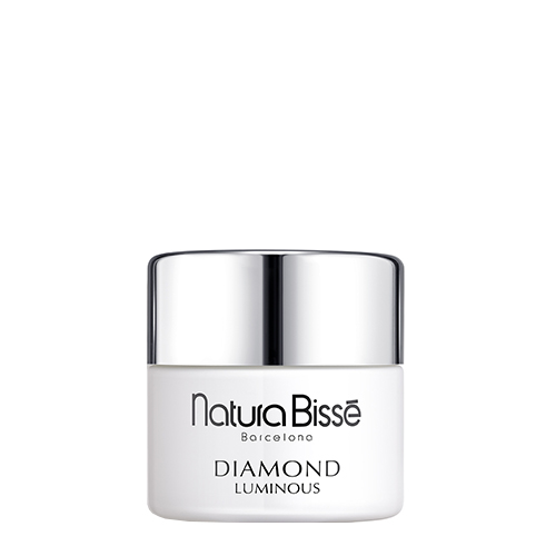 Een wit potje Natura Bissé Diamond Luminous Cream met een glanzende zilveren deksel.