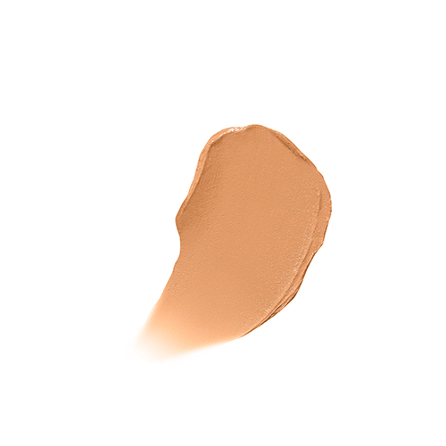 Een romige veeg van Jane Iredale Enlighten Concealer in Medium Intense Peach op een witte achtergrond. De textuur laat de egale, warme perzikroze tint en de dekkende formule zien.