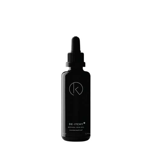 Een glanzend zwarte glazen flacon van IK Skin Perfection De Itchy met een handige pipetdop tegen een strakke witte achtergrond
