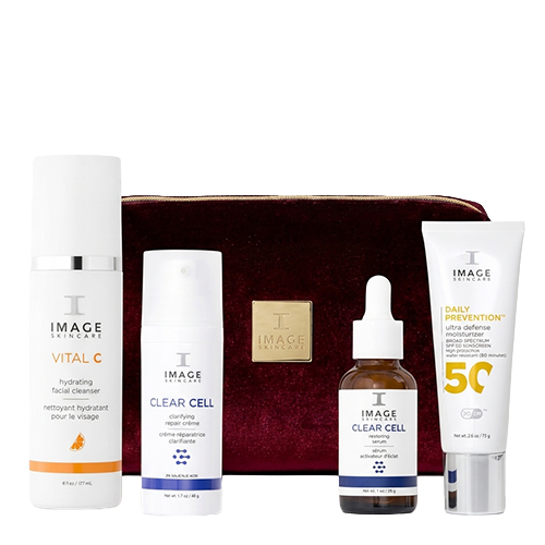 IMAGE Skincare kerstset met vier verzorgingsproducten waaronder Vital C cleanser Clear Cell creme serum en Daily Prevention SPF 50 voor een fluwelen tas