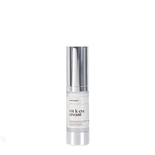 Een flesje Prescription Vitamin K Eye Cream met een zilveren dop op een egale witte achtergrond