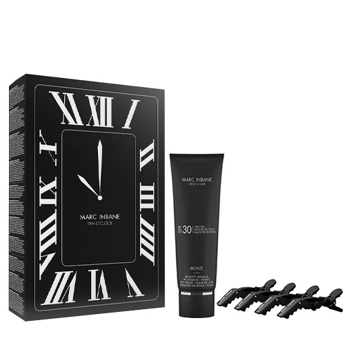 Luxe Marc Inbane Tan O'Clock geschenkverpakking met de Crème Bronze SPF30 tube en vier zwarte haarklemmen.