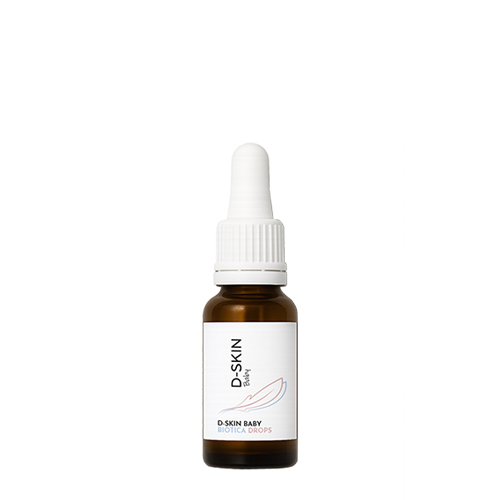 Een glazen flesje met pipet van D SKIN Baby Biotica Drops tegen een witte achtergrond