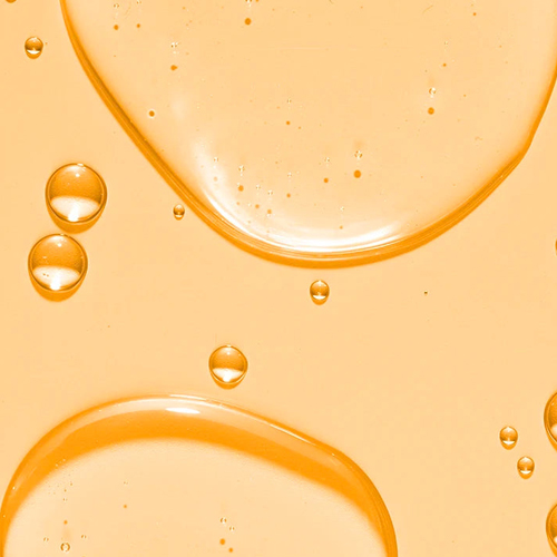 Textuur en druppels van de vitamine C reiniger