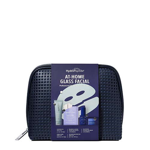 Complete HydroPeptide At Home Glass Facial set verpakt in de blauwe toilettas