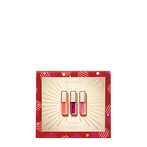 Feestelijke rode geschenkverpakking van het Jane Iredale Just Kissed Lip Trio met drie mini lipproducten