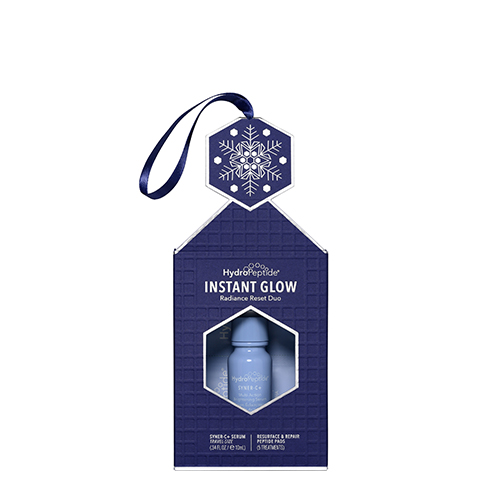 HydroPeptide Instant Glow kerstornament verpakking met lint om op te hangen
