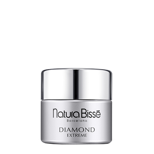 Een glazen pot Natura Bissé Diamond Extreme Cream Rich Texture, een volle anti-aging gezichtscrème met een zilveren dop.