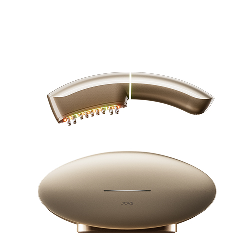 Het boogvormige JOVS Slimax anti-aging apparaat zwevend boven het ovale gouden basisstation met zichtbare behandelingslampjes