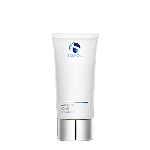 Goud-bruine flacon met pompje van iS Clinical Warming Honey Cleanser diepe reinigingshoning 120g
