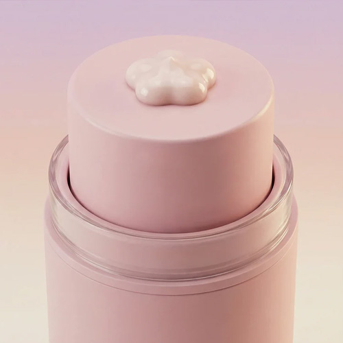 Bovenaanzicht van de Lila Loom Calm and Glow Cream pompflacon met een kleine hoeveelheid crème in de vorm van een bloemetje op de drukknop.