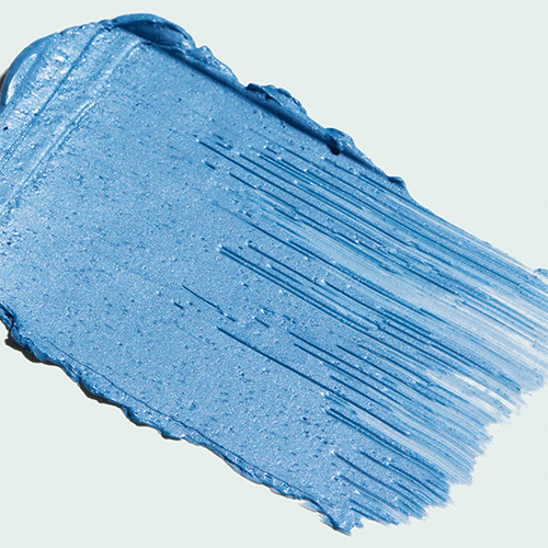 Close-up van de glinsterende blauwe textuur van het IMAGE Skincare Firming Transformation Masker.