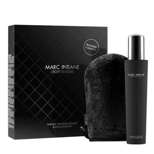 Een luxe zwarte geschenkdoos met ruitpatroon van Marc Inbane L'Éclat du Soleil naast een flacon Natural Tanning Mousse en een zwarte applicator handschoen