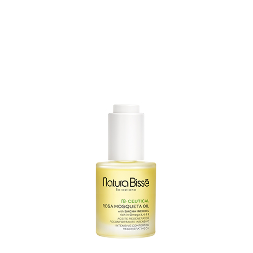 Een glazen flacon van Natura Bissé NB Ceutical Rosa Mosqueta Oil met een witte pipetdop, gevuld met goudgele olie op een witte achtergrond.