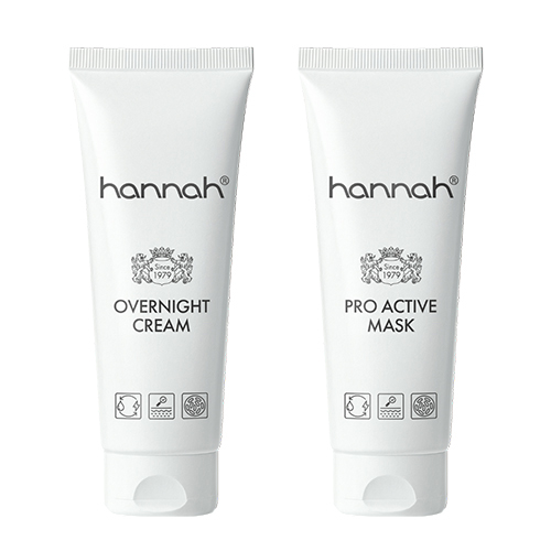 Twee witte tubes van het huidverzorgingsmerk hannah naast elkaar: de hannah Overnight Cream en het hannah Pro Active Mask uit de Glow & Go Night Set.