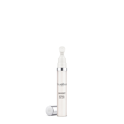 Een witte tube Natura Bissé Inhibit Retinol Eye Lift met een zilveren dop ernaast en een precisie-applicator.