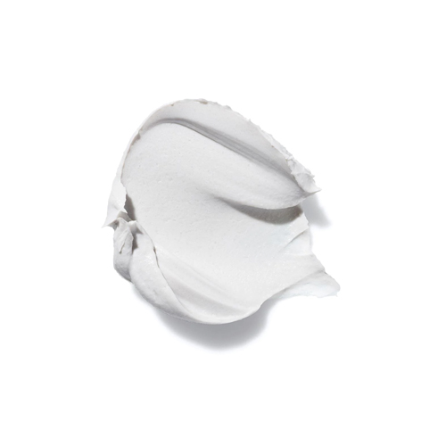 Een close-up van de romige, witte textuur van de HydroPeptide Miracle Mask los op een witte achtergrond.