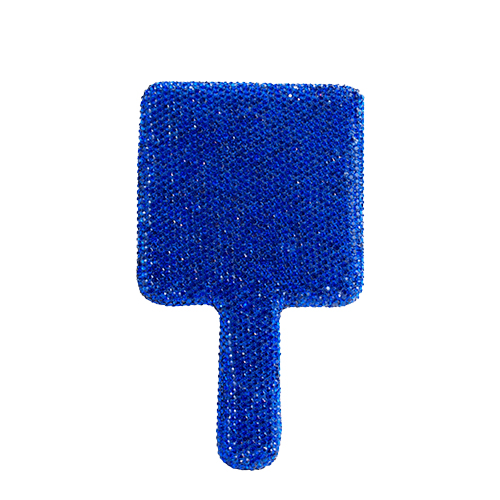 De achterkant van de lichtblauwe Nimya handspiegel met het gegraveerde Nimya-logo in het midden.