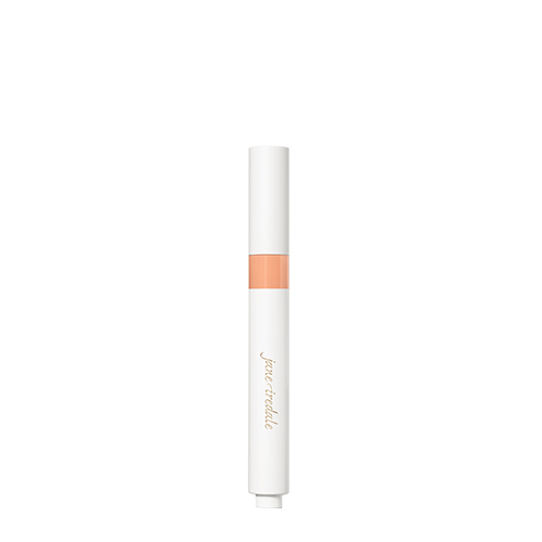 De witte huls van de jane iredale Skintuition Under Eye Concealer tint M8 met een zichtbaar kleurvenster