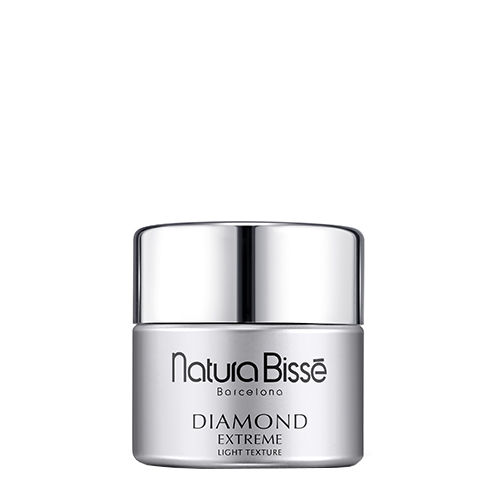 Een luxe glazen pot van de Natura Bissé Diamond Extreme Cream in de Light Texture uitvoering met een zilveren dop.