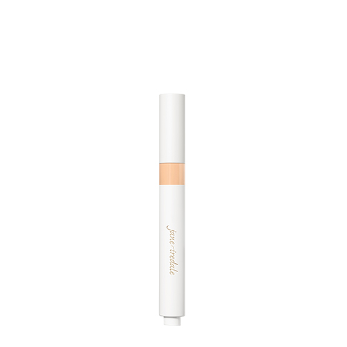 De witte huls van de Skintuition Brightening Under Eye Concealer L3 met het gouden jane iredale logo