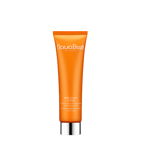 Een oranje tube Natura Bissé C+C Vitamin Scrub met een zilveren dop, een exfoliërende scrub voor gezicht en lichaam.