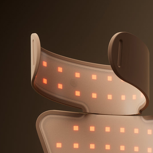 Een close up van de binnenkant van de flexibele band van het JOVS nekmasker met oplichtende vierkante oranje LED lampjes