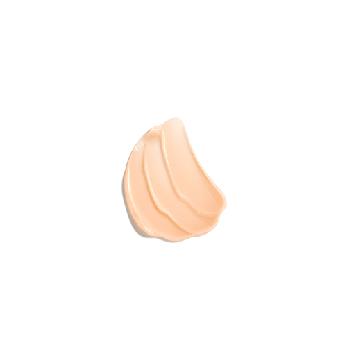 Een swatch van de zachte, perzikkleurige crème-textuur van de Natura Bissé Tolerance Enzyme Peel.
