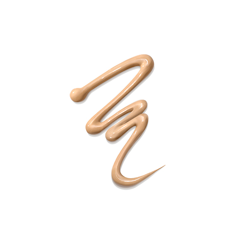 Een enkele, kronkelige lijn van de lichtbeige, vloeibare textuur van gekleurde oogcrème tegen een effen witte achtergrond.