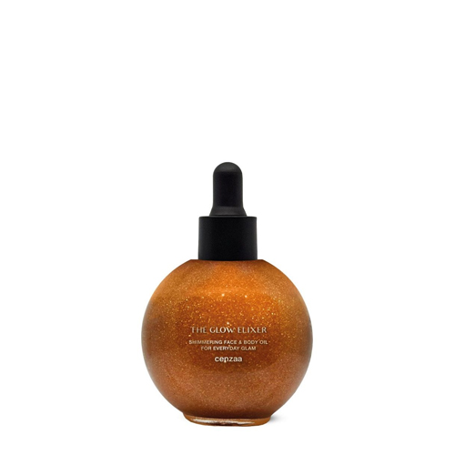 Een ronde glazen druppelflacon van Cenzaa 'The Glow Elixir' gevuld met een goudkleurige, glinsterende face en body oil tegen een witte achtergrond.
