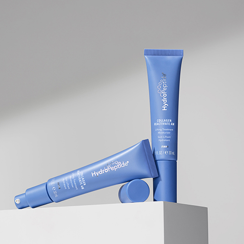 Twee blauwe tubes van HydroPeptide Collagen ReActivate AM op een strakke, lichte ondergrond.