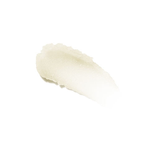 Een uitgesmeerde hoeveelheid balsemachtige reiniger op een witte achtergrond