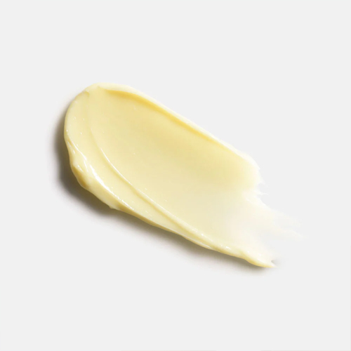 Een veeg van de gele crème textuur van de HydroPeptide Retinol Routine Booster 30ml op een witte achtergrond.