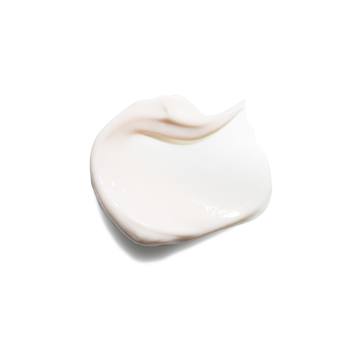 Een klodder zachte witte cleanser getoond op een lichte achtergrond