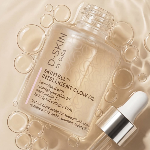 Sfeerbeeld van een flesje D-Skin Skintell Intelligent Glow Oil omringd door waterbubbels en een losse pipet