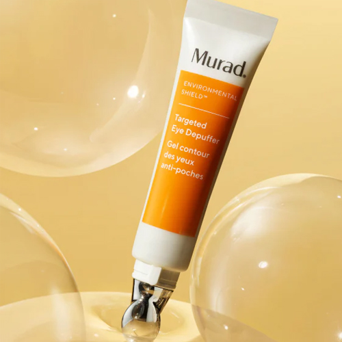 Murad Targeted Eye Depuffer tube omringd door lichte bubbels en gel textuur