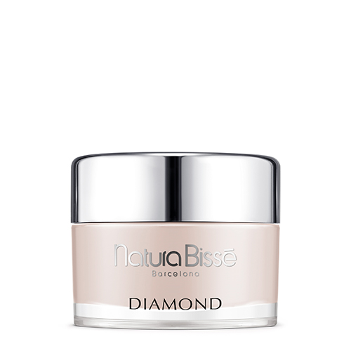 Een grote, luxe zilveren pot van de Natura Bissé Diamond Body Cream tegen een witte achtergrond.