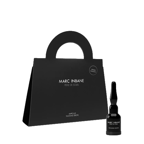 Zwarte verpakking in de vorm van een tasje met een kleine ampul Marc Inbane Perle de Soleil tanning drops erastand
