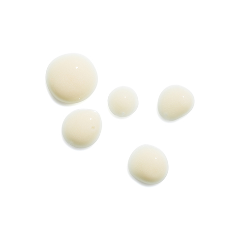Textuur van HydroPeptide Spot Correction crème getoond in verschillende druppels op een witte achtergrond