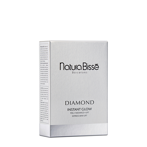 Een luxe doosje van Natura Bissé Diamond Instant Glow met daarin drie verschillende ampullen voor een directe peeling en glow effect.