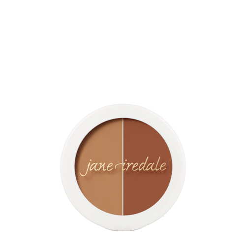 Een ronde compactdoos van Jane Iredale Circle Delete Concealer in Gold/Brown op een witte achtergrond. Bevat twee goudbruine tinten concealer: een lichtere goudbruine tint links en een donkerdere warmbruine tint rechts. Met het logo op de voorkant