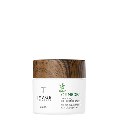 De herkenbare witte pot van 57 gram van de ORMEDIC Balancing Bio-Peptide Crème met witte verpakking houten draaidop en groene accenten