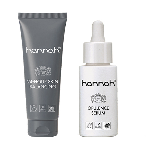 Een duo-set van hannah huidverzorging bestaande uit de 24-hour Skin Balancing crème in een grijze tube en het Opulence Serum in een wit flacon met pipet.