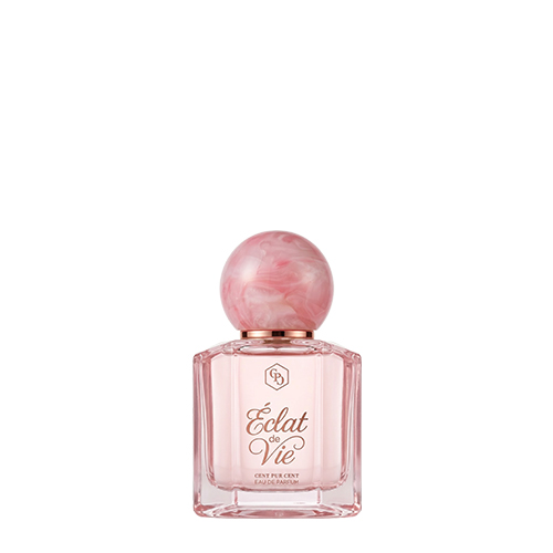 Een vierkante glazen flacon van Cent Pur Cent Éclat de Vie Eau de Parfum met een opvallende, roze gemarmerde ronde dop tegen een witte achtergrond.