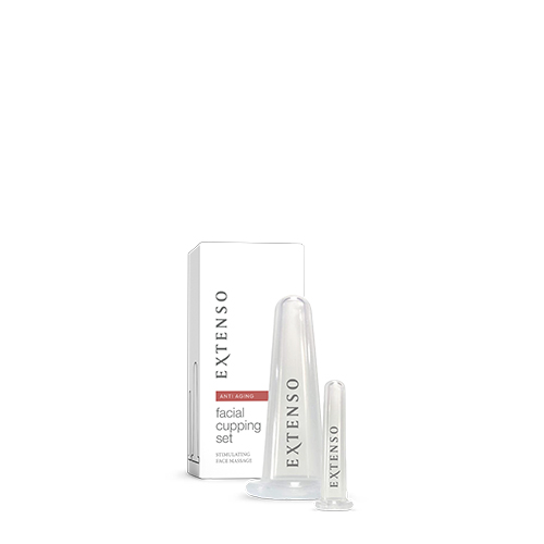 Extenso anti aging facial cupping set met een grote en kleine transparante gezichtscup naast de witte verpakking