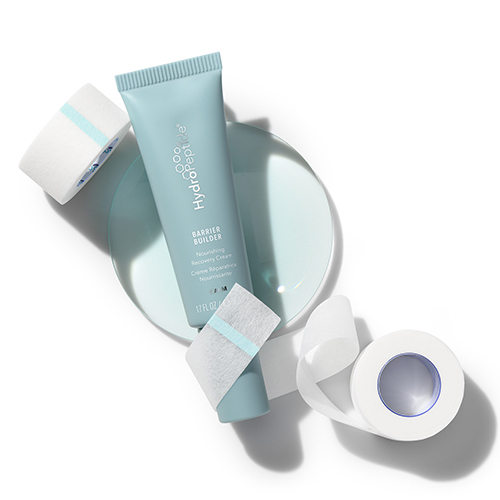 HydroPeptide Barrier Builder crème gepresenteerd met medische tape en pleisters op een lichte achtergrond