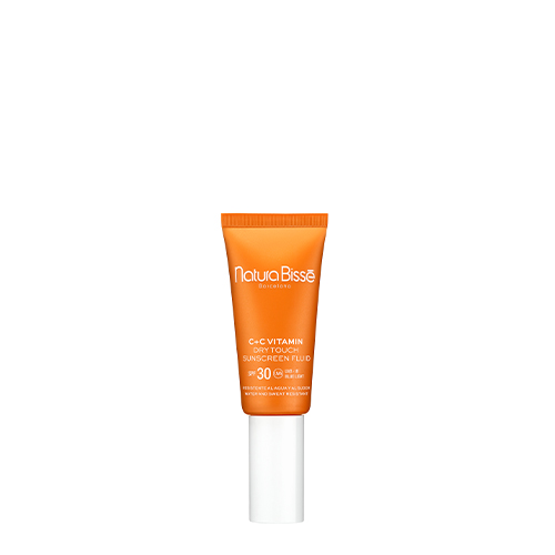 Een staande tube Natura Bissé C+C Vitamin Dry Touch Sunscreen Fluid SPF 30 in een opvallende oranje kleur met een witte dop, gepresenteerd tegen een witte achtergrond.